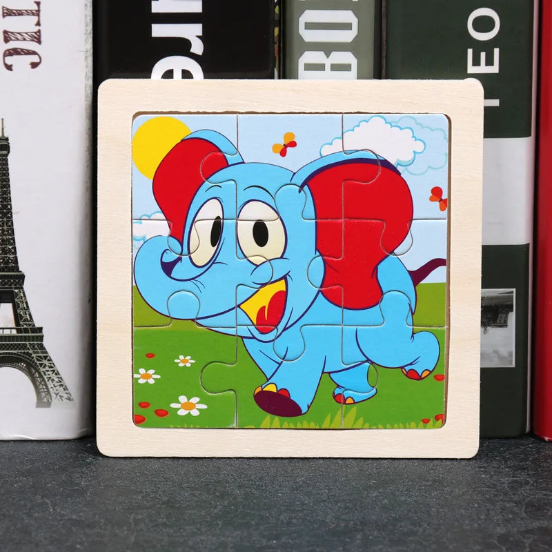 A wooden jigsaw puzzle featuring an animated blue elephant with red ears and a yellow sun in a green field.
