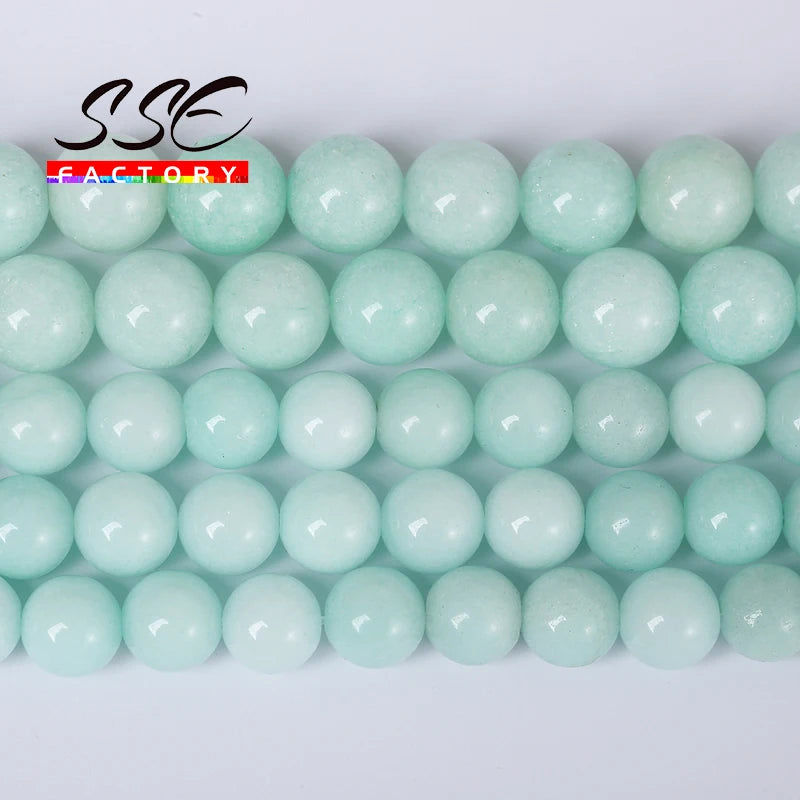 A row of light green natural blue amazonite round beads for jewelry making