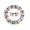 A circular arrangement of adorable sloth silicone beads in various shades of gray and blue for DIY crafts.