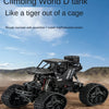 A black climbing World D tank off-road crawler truck is shown in a desert landscape.
