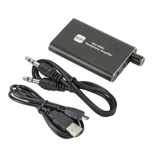 A black portable HiFi headphone amplifier with a cable and USB connector is shown.