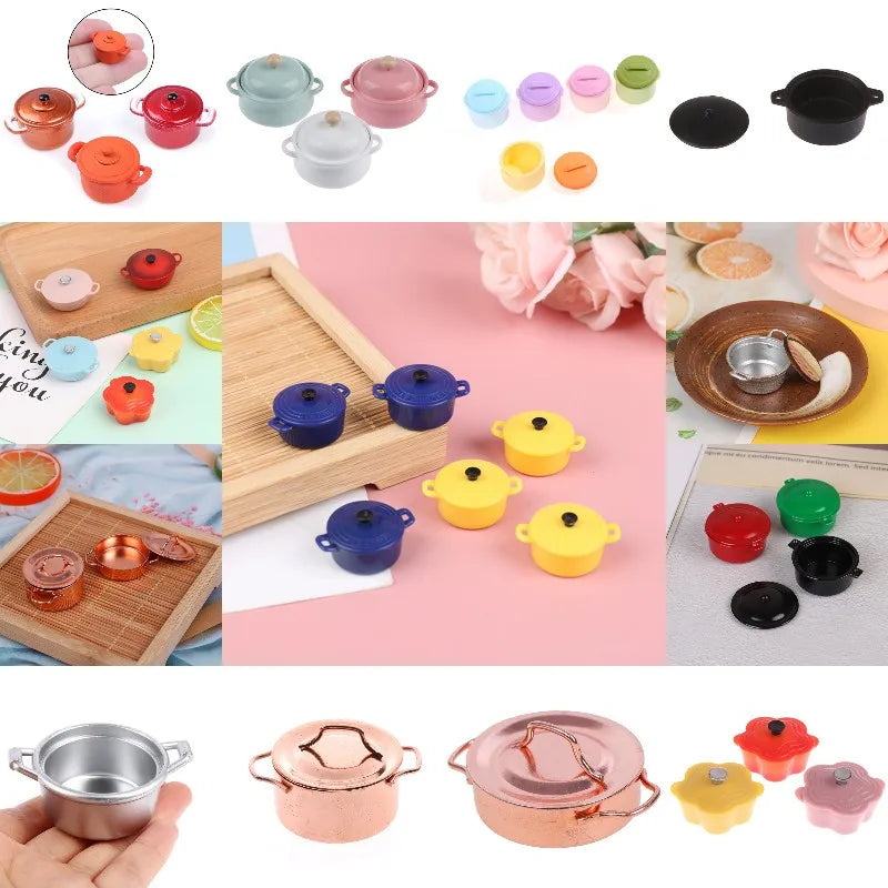 A collection of miniature copper soup pots and related kitchen items for a dollhouse setting.