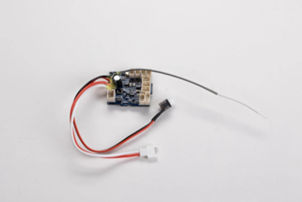 A small electronic circuit board with wires and a connector, part of a 1:12 scale RC car steering wheel upgrade set.