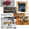 A set of finger skateboards, ramps, and accessories displayed on a wooden surface.