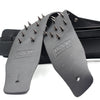 Black PU leather guitar strap with metal studs shown in a spread view.