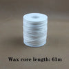 A roll of white wax core candle wicks with metal sustainers, measuring 61 meters long.