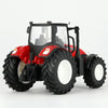 A red remote control tractor with a white cab, large tires, and a trailer is shown against a white background.