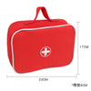 Red fabric medical kit with a handle and a white cross symbol for children