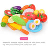 A colorful pretend play cutting set featuring various fruits and vegetables like watermelon, tomato, and egg.