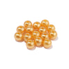 A cluster of small, round, golden-yellow imitation pearl beads for DIY jewelry making.