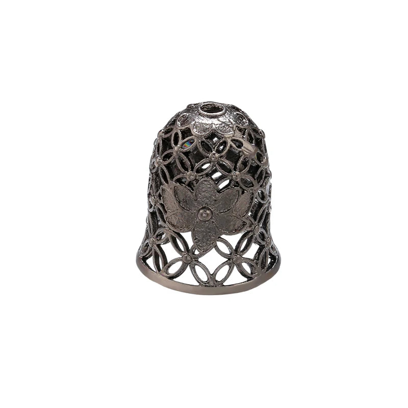 Silver metal bead cap with intricate floral pattern and openwork design