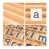 A set of wooden alphabet cards and letter tiles for Montessori learning, featuring red and blue letters.