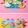 A colorful cloth book featuring various animal characters like a lamb, duck, and tiger for baby sensory development.