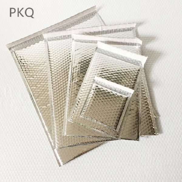 Stack of silver aluminum foil bubble mailer bags