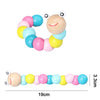 A wooden sensory block set featuring colorful balls and a wooden face, used for Montessori play.