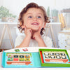 A child is holding an open magnetic animal and number matching game featuring various animals and houses.