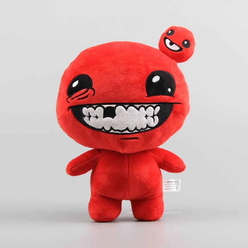 A small, bright red collectible plush toy resembling a monster with large eyes and a wide, toothy grin.