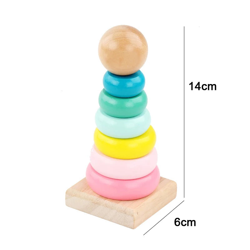 Stack of colorful wooden sensory blocks and music rattle on a light wooden base