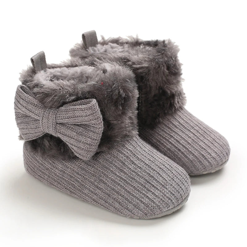 Gray knitted winter ankle boots for babies with faux fur trim and anti-slip soles