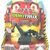 A Dinotrux dinosaur truck toy car with removable dinosaur figures displayed in its packaging.