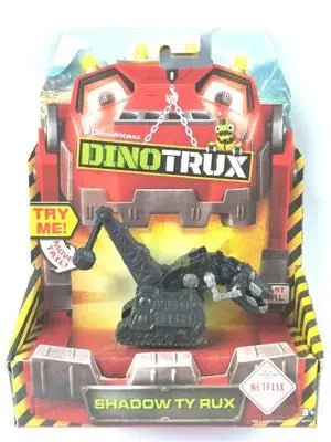 A Dinotrux dinosaur truck toy car with removable dinosaur figures displayed in its packaging.