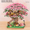A detailed building block set of a Sakura tree house featuring pink flowers and wooden structures.