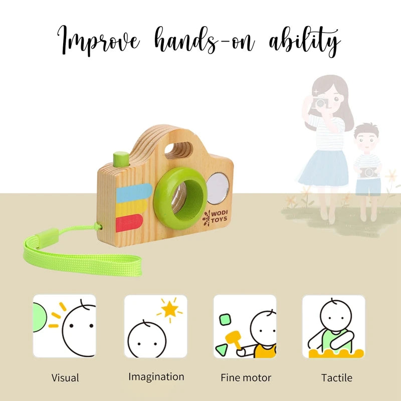 A wooden camera teether toy with a green grip and yellow accents, shown next to children demonstrating visual, imagination, f