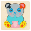 A wooden puzzle of a cute, stylized panda face with large eyes and pink ears.