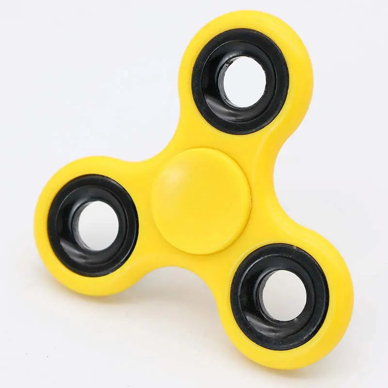 Yellow ABS tri-spinner fidget toy with black rings for focus and stress relief