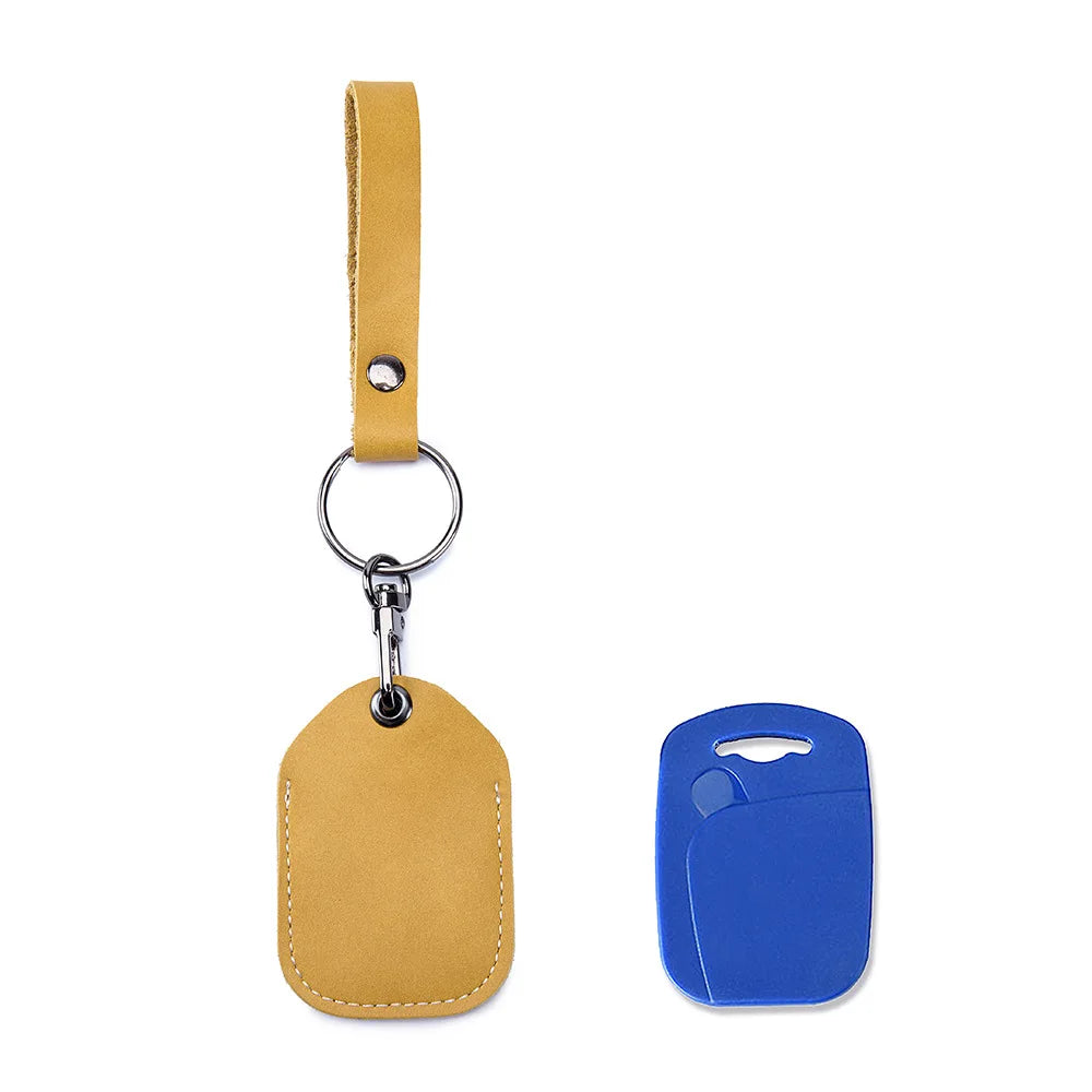 A tan leather key wallet with a hanging loop and a blue plastic card holder.