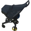 Black stroller accessory kit featuring a mosquito net, rain cover, and other components.