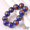A string of blue ceramic beads decorated with red and green floral patterns for jewelry making