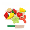 A wooden magnetic fruit and vegetable cutting play set featuring various colorful, shaped pieces like an apple, watermelon sl