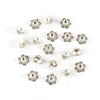 A collection of small, silver Tibetan style hollow flower bead caps for jewelry making arranged on a white background.