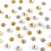 A collection of small, gold and silver Tibetan style hollow flower bead caps for jewelry making.