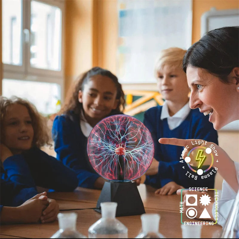 A close-up of a student pointing at a glowing touch-sensitive plasma ball lamp in a classroom setting.