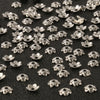 Small silver hollow flower bead caps used for jewelry making