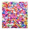 A close-up view of colorful soft polymer clay candy sprinkles in various shapes and colors for cake decorating