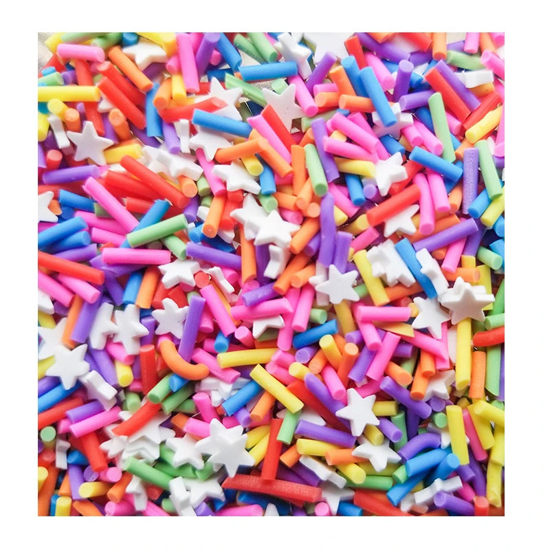 A close-up view of colorful soft polymer clay candy sprinkles in various shapes and colors for cake decorating