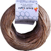 A spool of brown organic hemp wick with a white label showing the product details.