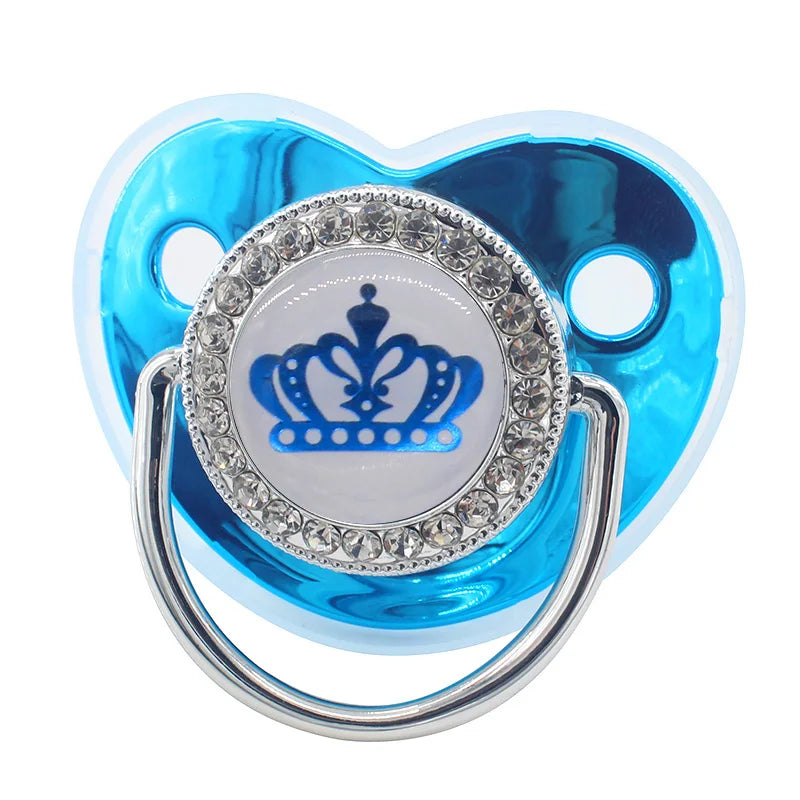 Rose gold crystal bling pacifier with a crown design and a clear silicone ring