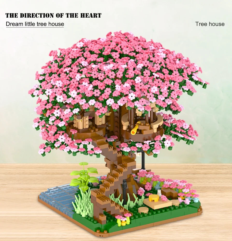 A detailed LEGO set depicting a pink flowering tree house with wooden structures and greenery.