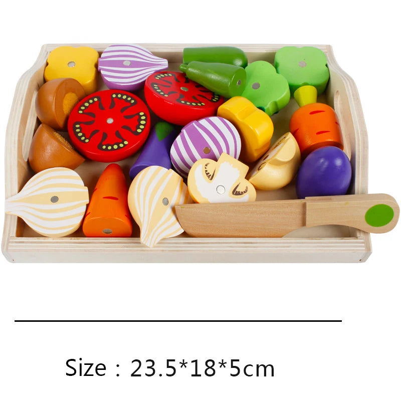 A wooden magnetic fruit and vegetable cutting play set with various colored, shaped pieces in a light wooden tray.