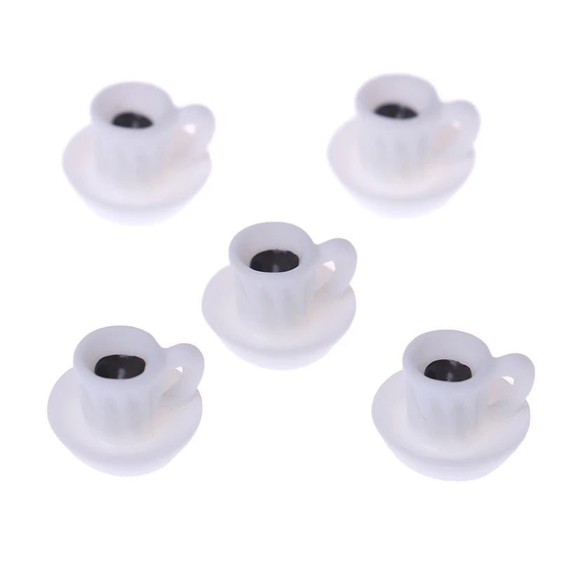 A set of five small white resin coffee cups designed for dollhouse kitchens.