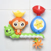 A colorful bath toy set featuring a yellow duck character with sliding tracks and an orange crown.