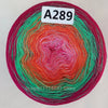 A spool of rainbow gradient mercerized cotton cake yarn labeled A289