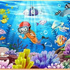 A colorful wooden jigsaw puzzle featuring an underwater scene with fish, sea creatures, and coral.