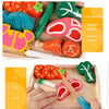 A wooden magnetic fruit and vegetable cutting play set showing various fruits and vegetables for cognitive development.
