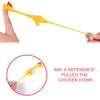 Yellow stretchy rubber chicken slingshot fidget toy being pulled down