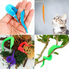 A collection of colorful magical trick bags featuring blue, orange, purple, and green snakes for stage performance.